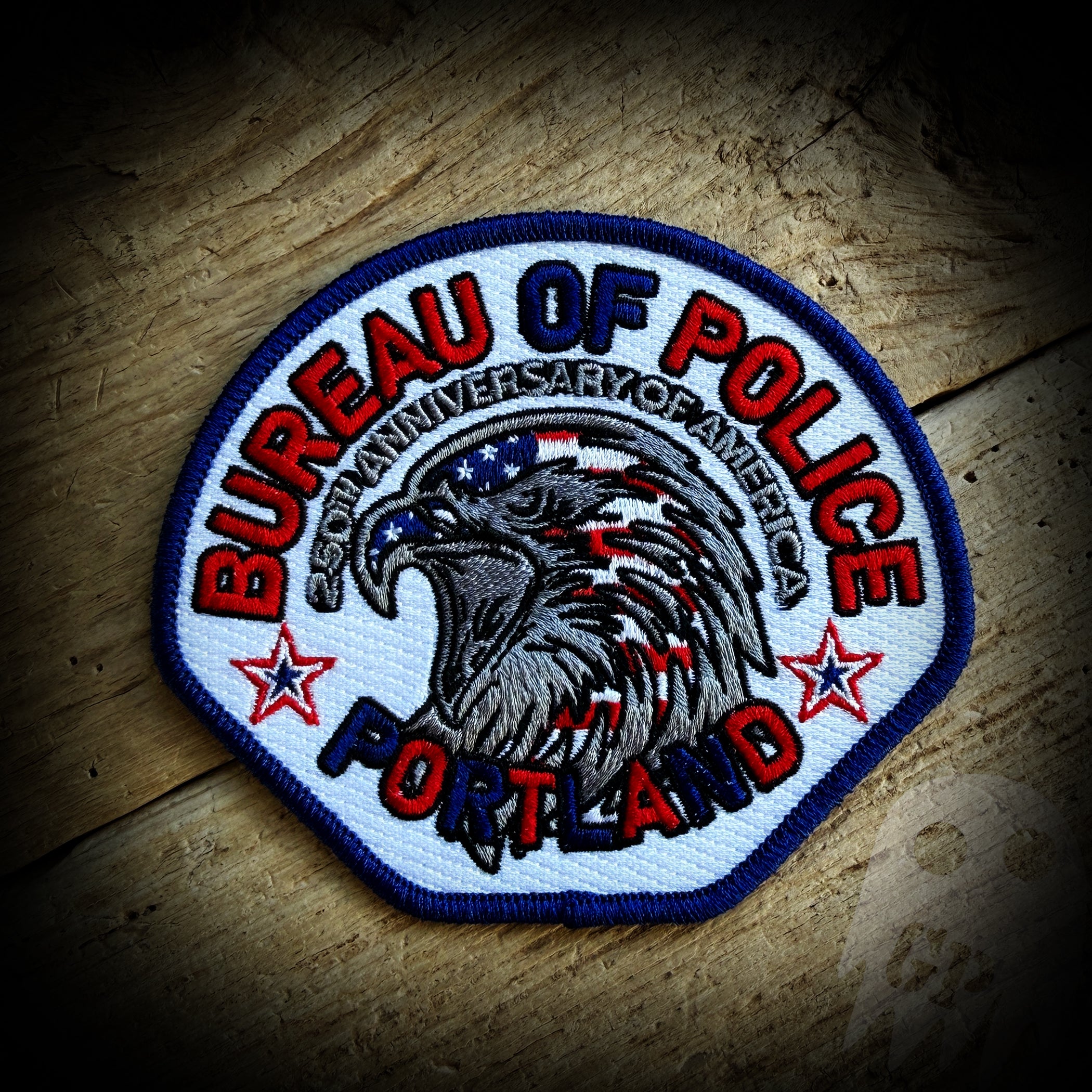 Portland, Oregon Police Department Commemorative 250th Anniversary of America Embroidered Patch. Patriotic eagle with stars.
This is a 4.25" 100% embroidered patch with iron on backing.